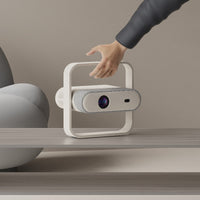 Home projector with integrated adjustable gimbal stand