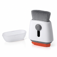 Good Grips Sweep & Swipe Laptop Cleaner with ergonomic handle and dual functionality.