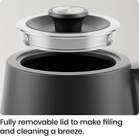 Gooseneck electric kettle pouring hot water for pour-over coffee