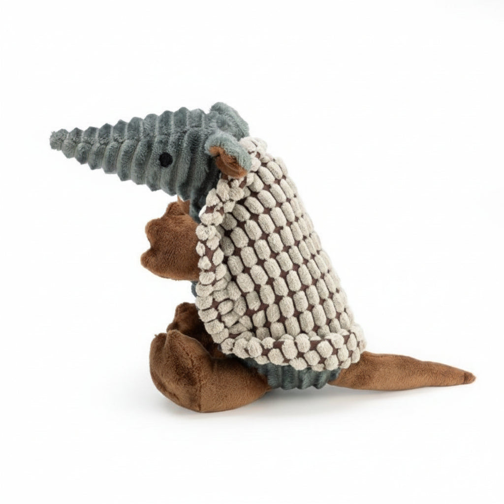 Side view of a gray plush dog toy