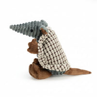 Side view of a gray plush dog toy
