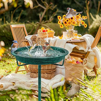 Green metal bird bath for garden patio and yard decor