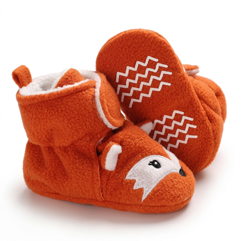 Pair of grey baby winter booties with fluffy cream ankle cuffs on a white background