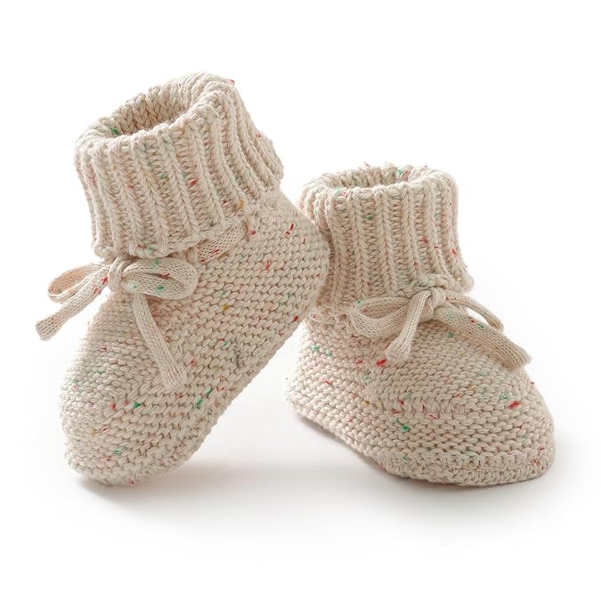 Pair of grey fleece baby booties with fluffy cream ankle cuffs on a white background.