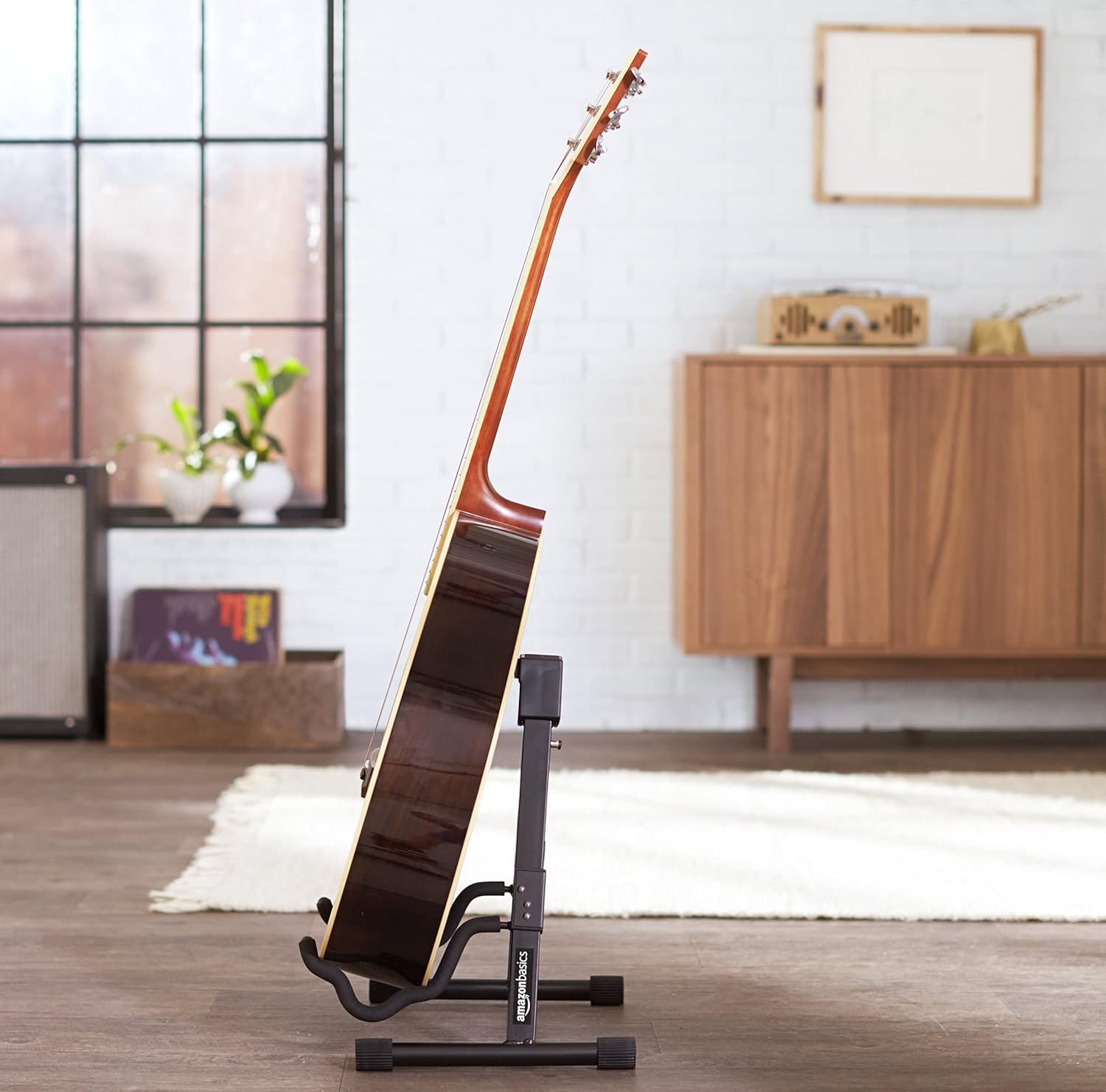 Easy setup of adjustable guitar stand, ideal for home, studio, or performance use