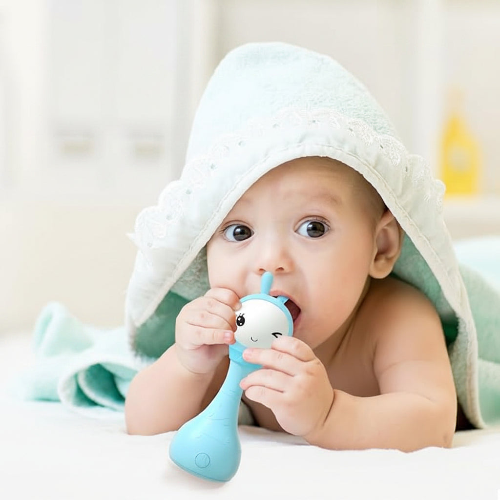 Handheld musical baby rattle with colourful buttons and easy-grip design