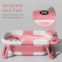 Front perspective of the contoured bathing basin with its raised white rim and padded insert.