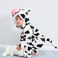 Baby wearing a playful farm animal hood with rounded ears and a pink muzzle.