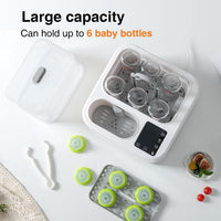 Two amber-coloured bottle accessory holders integrated into the front of the appliance