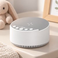 Parent preparing a baby's bedtime routine with a tabletop audio machine