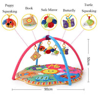Infant activity mat with hanging soft toys and crossed play arches