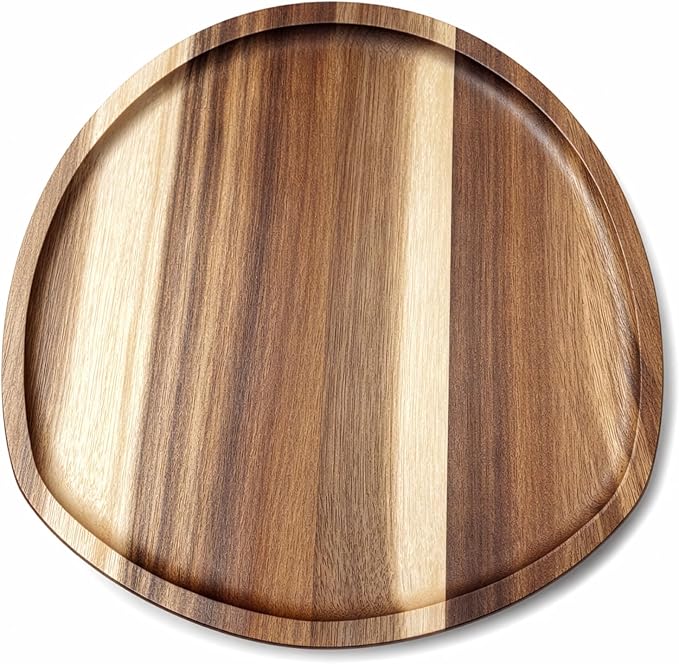 Irregular oval acacia wood serving plates in assorted sizes