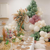 Jungle safari theme balloon decoration with green and gold balloons