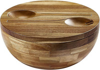 Large wood serving bowl filled with fresh salad