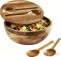 Large wooden salad bowl with matching serving utensils