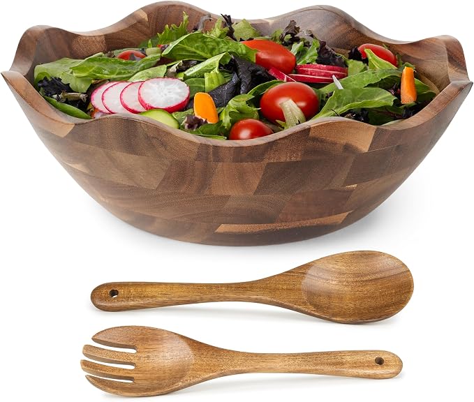 Large wooden salad bowl with matching serving utensils
