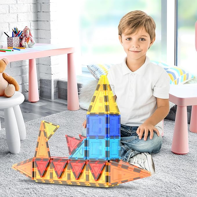 Magnetic building blocks for kids ages 3 and above arranged for imaginative play.