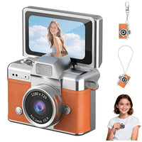 Silver and brown mini digital camera with a flip-up display and compact retro-style body on a white background.