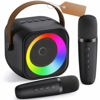 Mini portable karaoke machine with Bluetooth connectivity, 2 wireless microphones, and built-in party lights