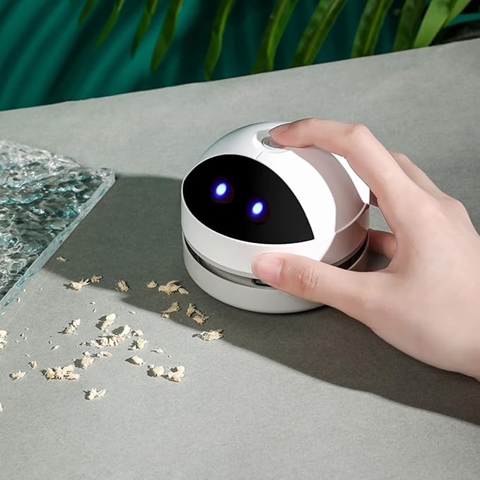 Mini Desktop Vacuum Cleaner for Efficient Cleaning of Crumbs, Pet Hair, and Flakes from Desk and Tabletop.