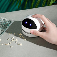 Mini Desktop Vacuum Cleaner for Efficient Cleaning of Crumbs, Pet Hair, and Flakes from Desk and Tabletop.