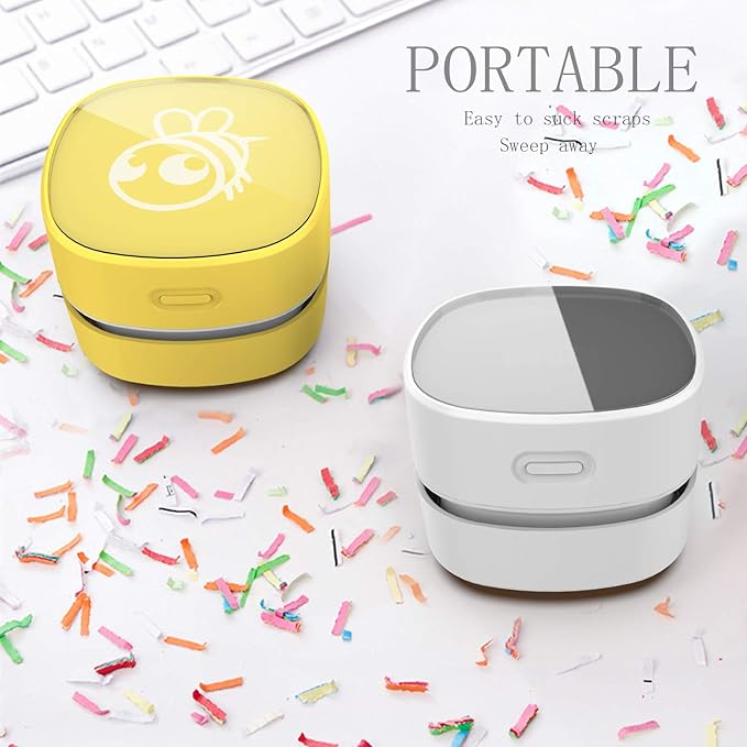 White Mini Vacuum Cleaner Powered by AA Batteries for 90 Minutes of Use.