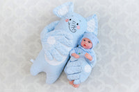 Close-up of soft moving hand on baby patting pillow