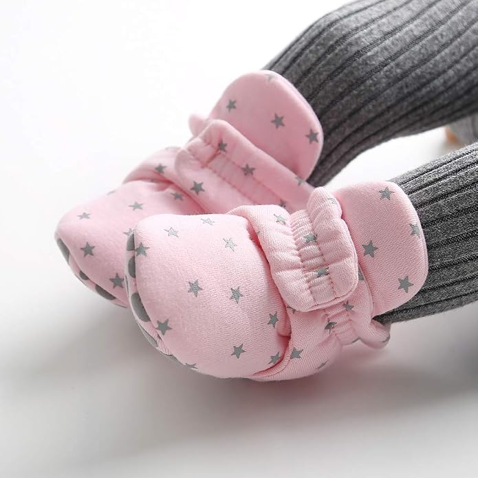 Front view of rounded infant shoes made with soft-looking textile fabric.