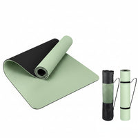 Textured yoga mat with carrying strap for home exercise