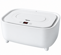 Baby tissue warming unit positioned on a clean nursery changing table.