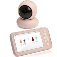 Pink baby monitor camera with a rounded lens housing and matching handheld parent display on a white background.