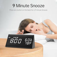 Plug in digital alarm clock in black wood style finish