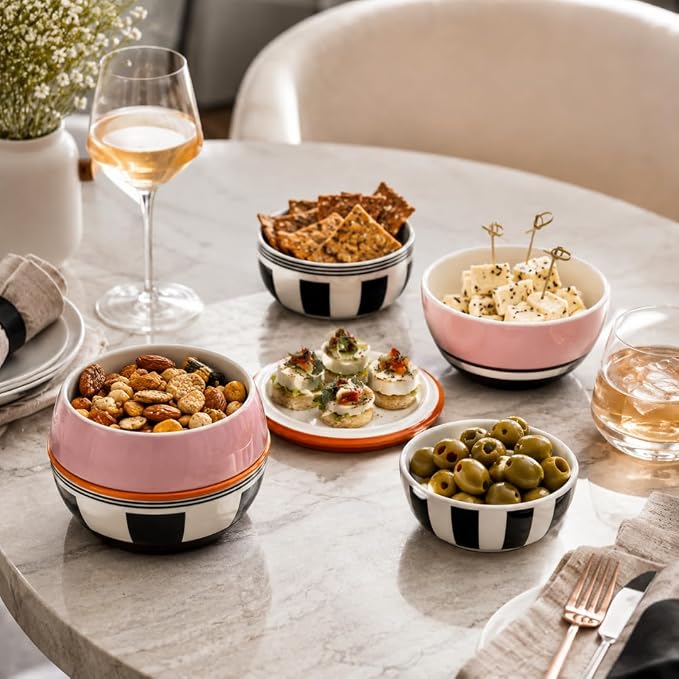 Small porcelain bowls arranged with dips snacks and desserts