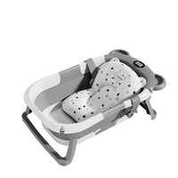 Overhead photograph showing the bathtub interior and removable-looking cushioned support.