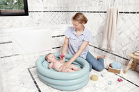 Portable inflatable bathtub suitable for travel and home use