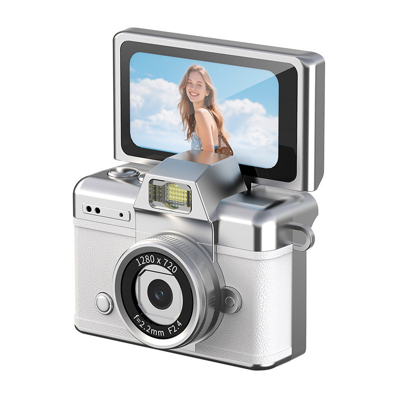 Traveler using a lightweight retro-style camera to photograph a scenic outdoor destination.