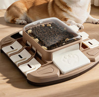 Press-and-slide pet puzzle feeder with movable food dispensing sections