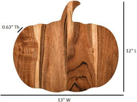 Pumpkin wooden charcuterie board arranged with snacks