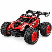 RC climbing car navigating small obstacles during an outdoor driving activity.