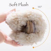 Detailed photograph showing the curly plush texture of the cosy footwear.