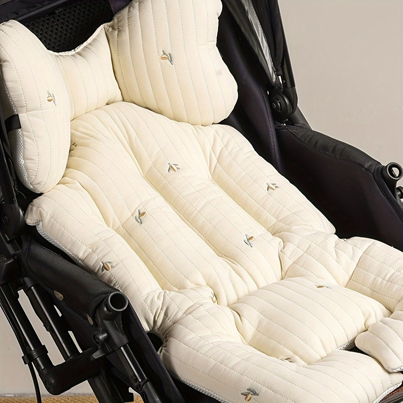 Soft infant stroller cushion with extra padding for support