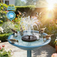 Close-up of solar-powered fountain pump with nozzles creating water spray in a garden.