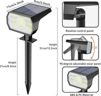 solar spotlight illuminating garden yard at night with bright cool white LED lighting