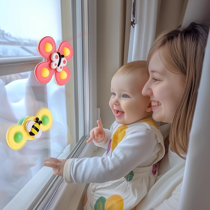 spinning top baby toy with suction base for interactive play
