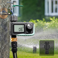 Close-up of programmable sprinkler timer with digital controls for setting watering schedules