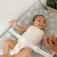 Serenity soft changing pad placed on a standard white nursery dresser