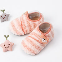 Overhead view of matching textile shoes with broad toe coverage.