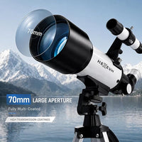 Telescope with phone adapter and remote control for moon photography