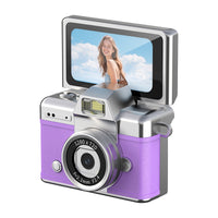 Traveler holding a pocket-sized camera while photographing an outdoor destination
