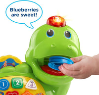 Toddler counting activity toy with a playful green dinosaur design.